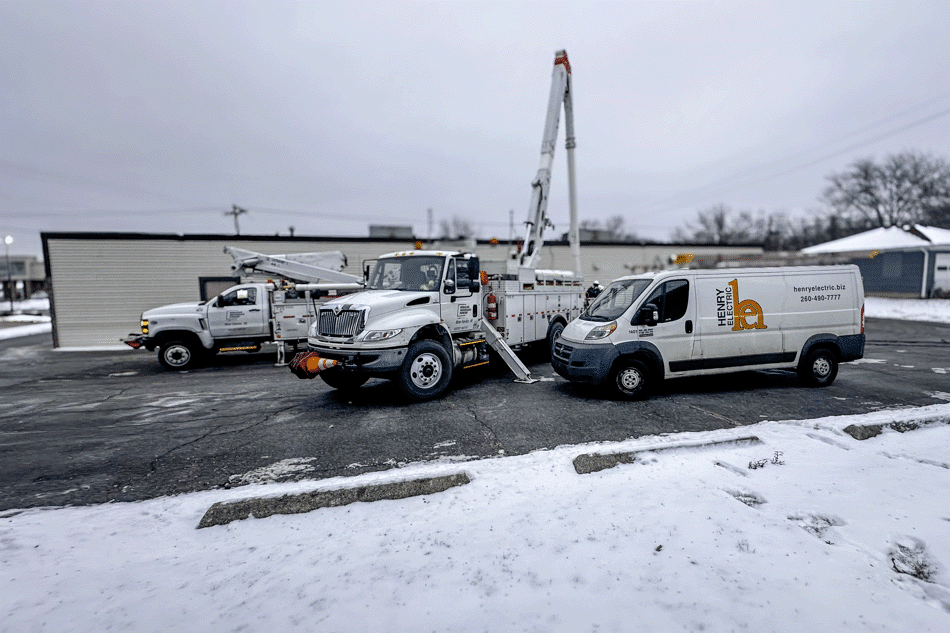 Dental Clinic Loses Power and Indiana Michigan Power AEP trucks along with Henry Electric are shown helping in the snowy landscape.