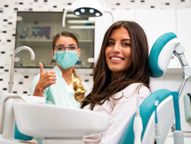 Woman and dental assistant at the dentist in fort wayne